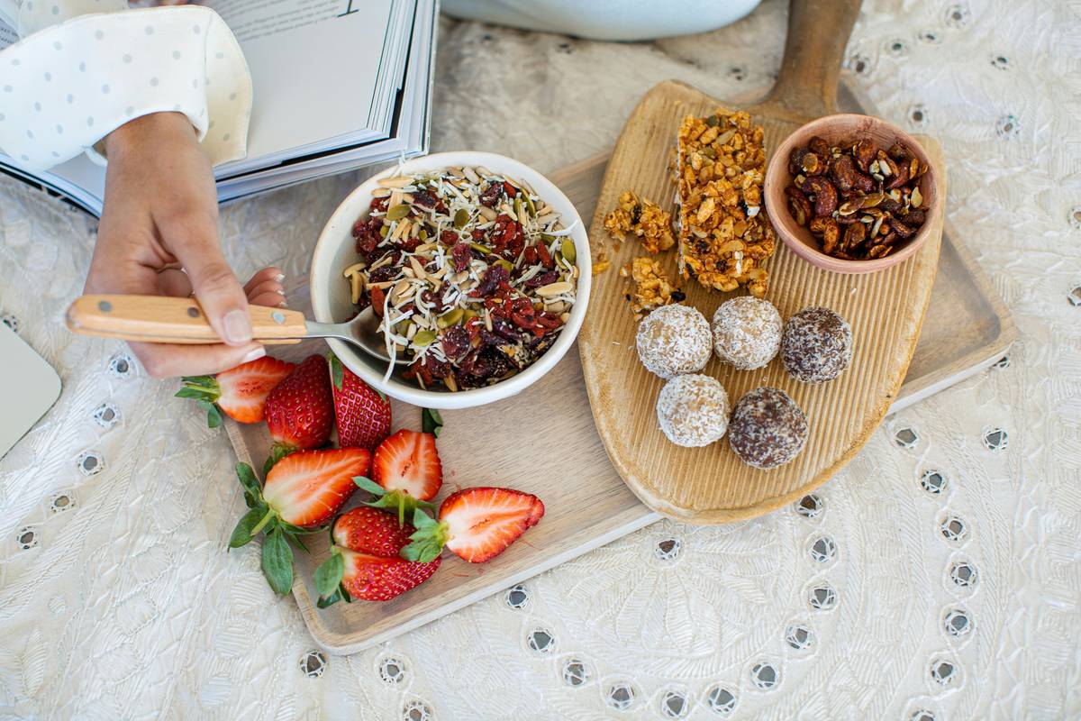Homemade organic immunity bites with superfood ingredients like dates, seeds, and camu camu powder
